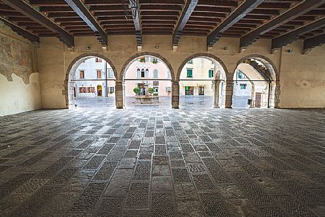 Loggia of Venzone village. It was declared National Monument in 1965 as unique fortified village of the XIV century in the region, Friuli Venezia Giulia, Italy