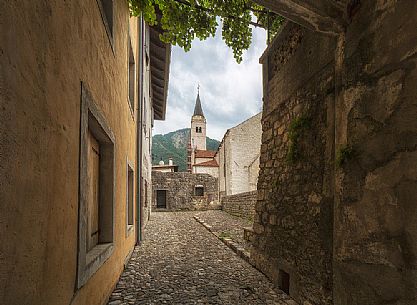 Downtown of Venzone village. It was declared National Monument in 1965 as unique fortified village of the XIV century in the region, Friuli Venezia Giulia, Italy Downtown of Venzone village. It was declared National Monument in 1965 as unique fortified village of the XIV century in the region, Friuli Venezia Giulia, Italy