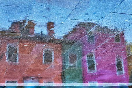 Unusual view of Burano village where every house is painted different color, Venice, Italy