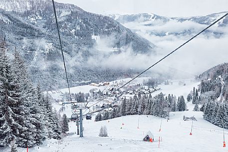 The Brunnach ski area and the traditional village of St Oswald in the clouds, Bad Kleinkirchheim, Carinthia, Austria, Europe