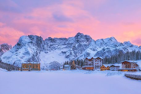 Winter sunset in lake Misurina with Sorapiss mountain range, dolomites, Veneto, Italy, Europe