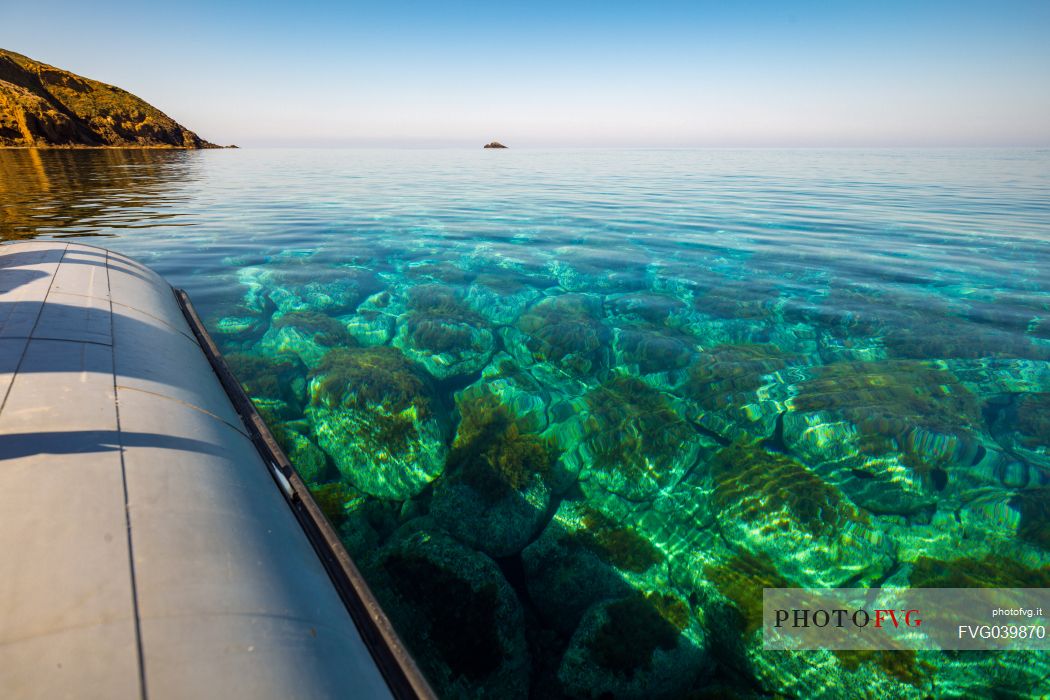 Boat trip in the transparent water of the sea, Ustica sea, Sicily, Italy