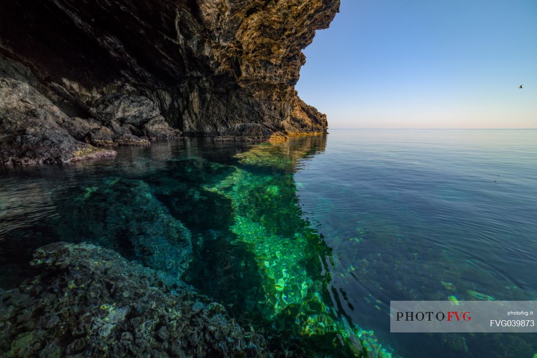Transparent water and cliff in the sea of Ustica, Sicily, Italy