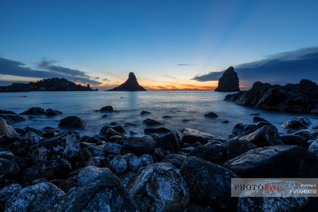 Lachea island and Faraglioni of Aci Trezza at dawn, Ciclopi archipelago, Sicily, Italy, Europe