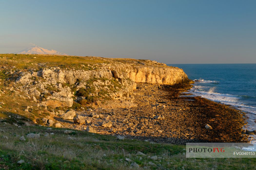 Siracusa coastline and in the background the Monte Etna covered by snow, Sicily, Italy, Europe