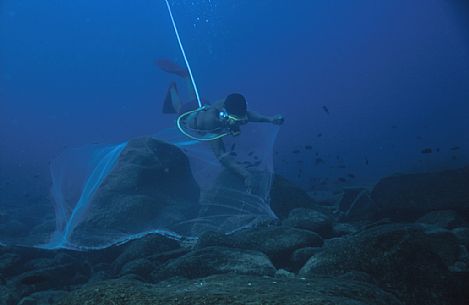 Fisherman of cichlids in action,  Likoma Island, Malawi, Africa