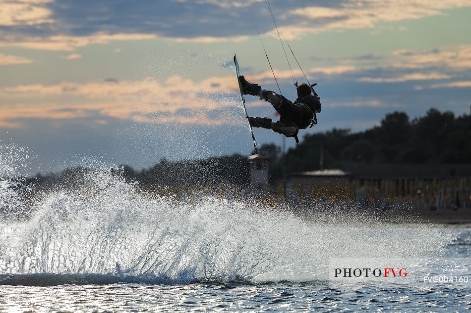 Jumpof a kitesurfer  on the sea