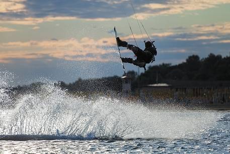 Jumpof a kitesurfer  on the sea