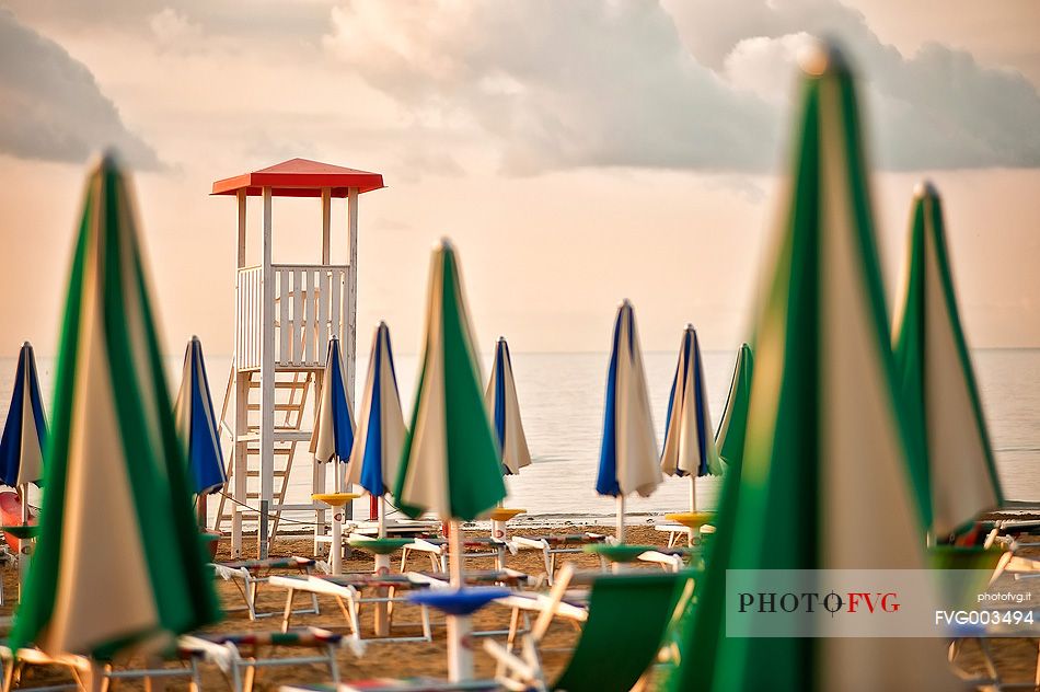 Umbrellas on the beach of the popular tourist destination of Lignano Sabbiadoro, Friuli Venezia Giulia, Italy, Europe