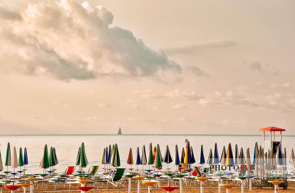 Umbrellas on the beach of the popular tourist destination of Lignano Sabbiadoro, Friuli Venezia Giulia, Italy, Europe