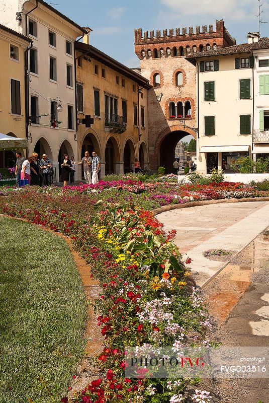 Flower festival in San Vito al Tagliamento, in the background the Raimonda tower gate, Friuli Venezia Giulia, Italy, Europe