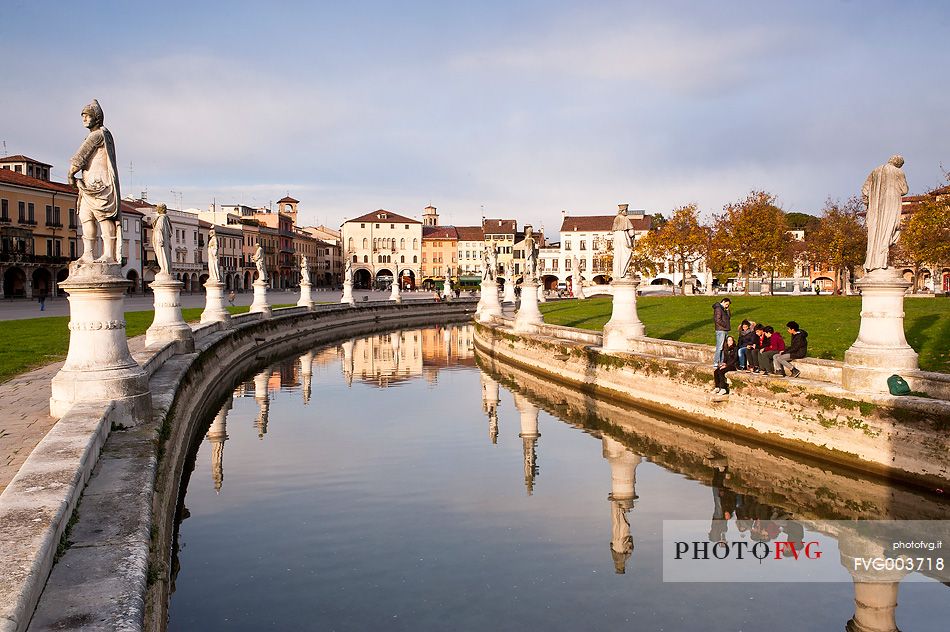 Prato della Valle is a square elliptical  in Padova, Italy. It is the largest square in Italy and one of the largest in Europe. Today, the square is a large space with a green island at the center, l'Isola Memmia, surrounded by a small canal bordered by two rings of statue, Italy, Europe