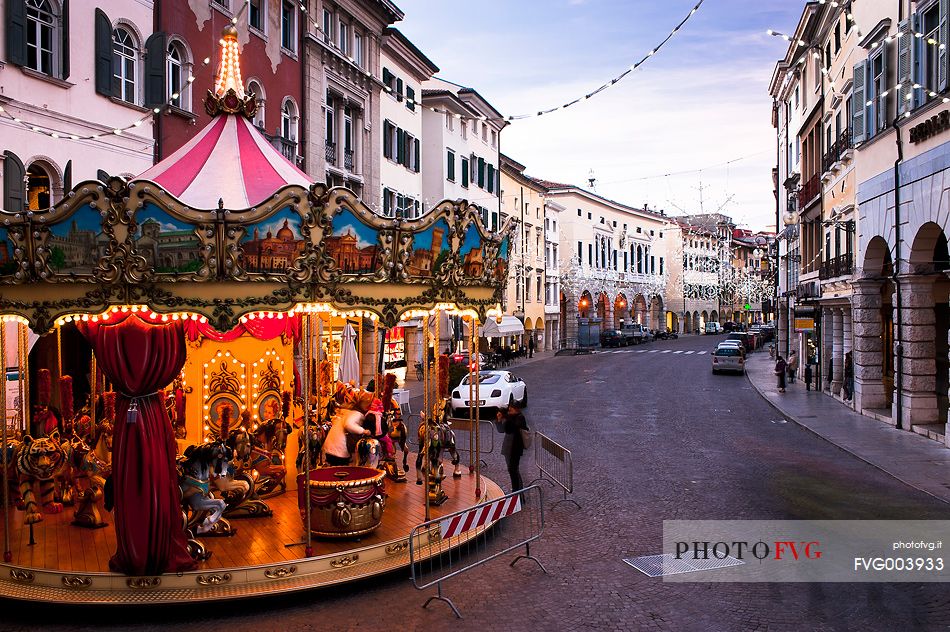 Carousel and Christmas lights in the town center in Udine, Friuli Venezia Giulia, Italy, Europe