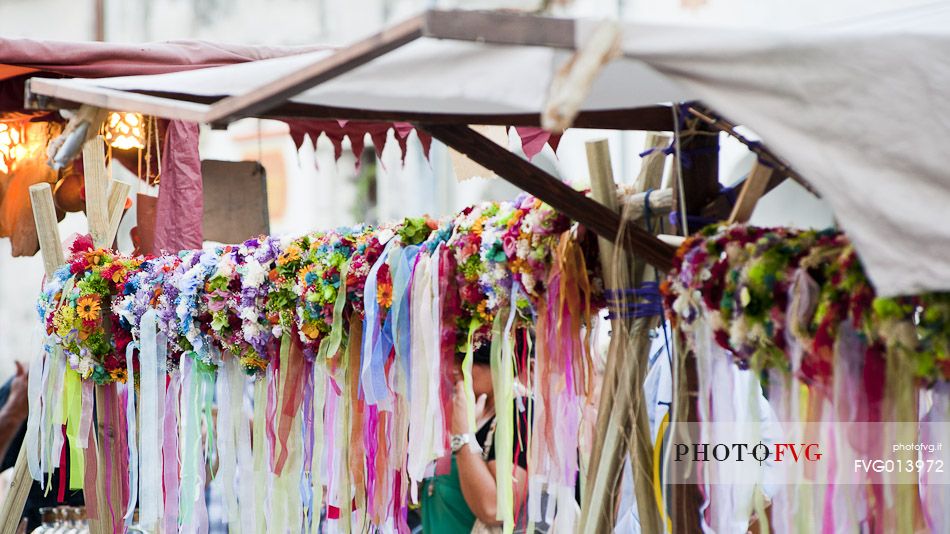 Crowns of flowers for young maidens in a historical reconstruction in Valvasone village, Friuli Venezia Giulia, Italy