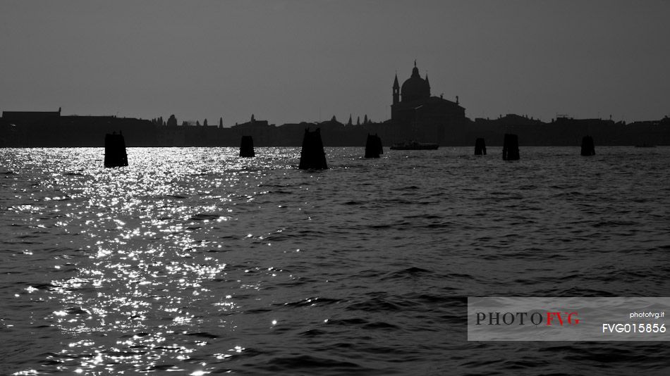 The silhouette of  Chiesa del Santissimo Redentore. It is a 16th-century Roman Catholic church located on Giudecca Island, in the city of Venice, Italy, Europe