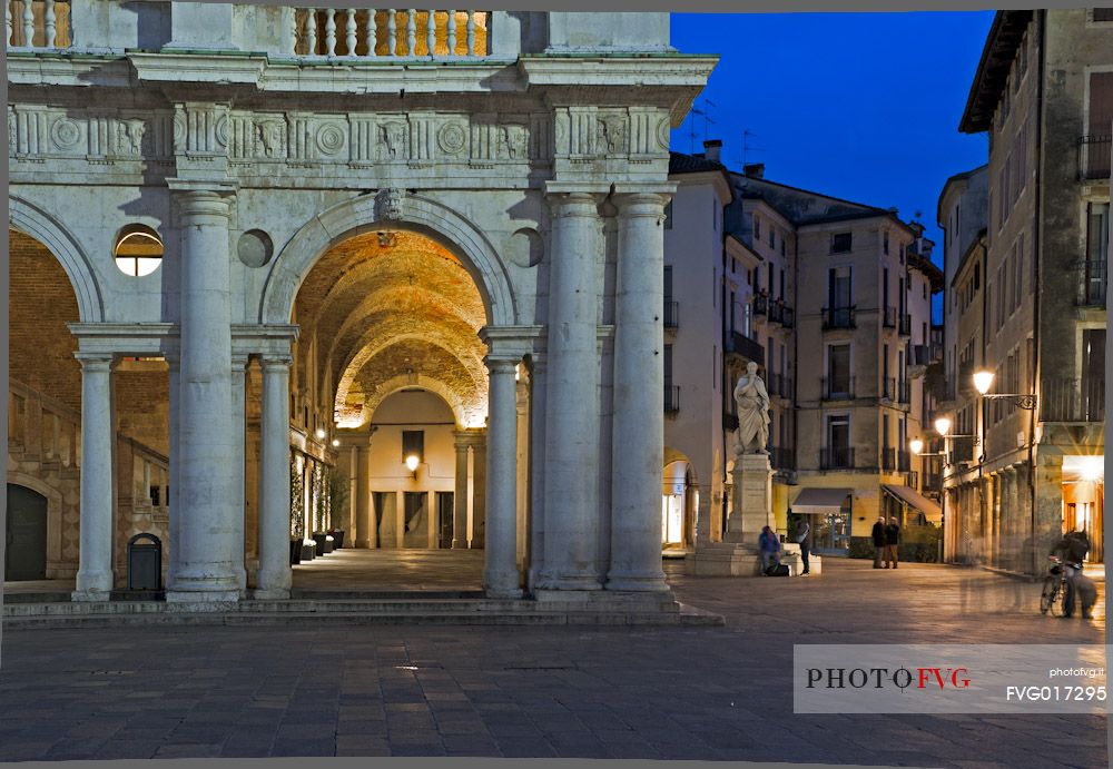 Detail of the Basilica Palladiana at twilight, It is a Renaissance building in the central Piazza dei Signori in Vicenza. Beside the statue of the architect Andrea Palladio, Vicenza, Italy, Europe