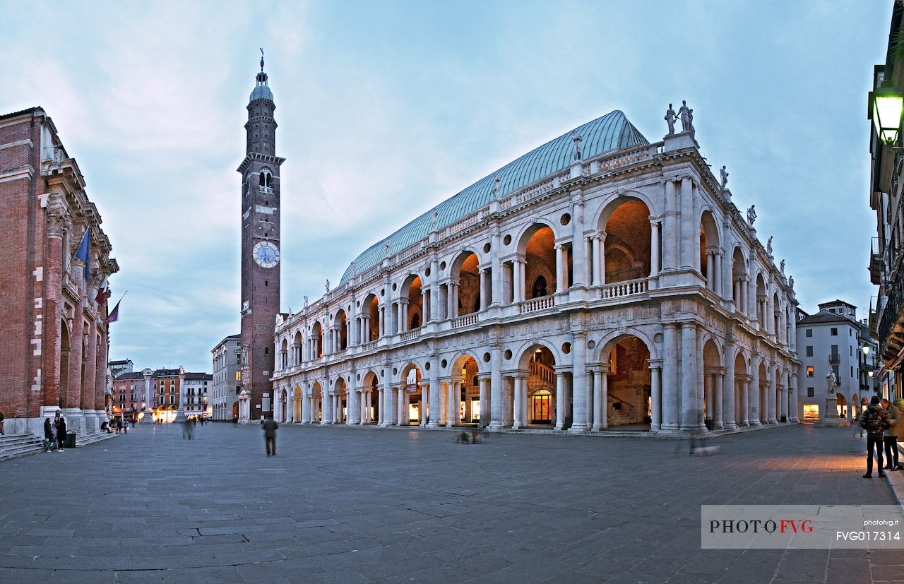 The Palladian Basilica or Basiica Palladiana, symbol of the city, with the Bissara tower and on the left the Palace Capitanio. Piazza dei Signori, Vicenza, Italy, Europe