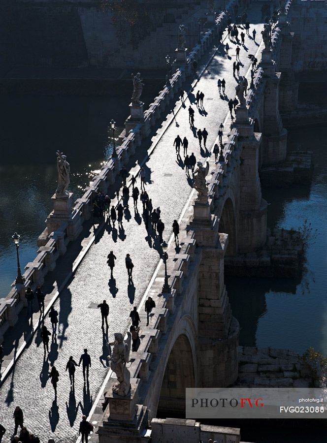 Tourists on the bridge Sant'Angelo in Rome. Italy