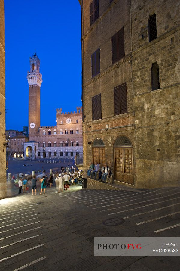 Tower of Mangia and Palazzo Pubblico in the Piazza del Campo square by night, Siena, Tuscany, Italy.