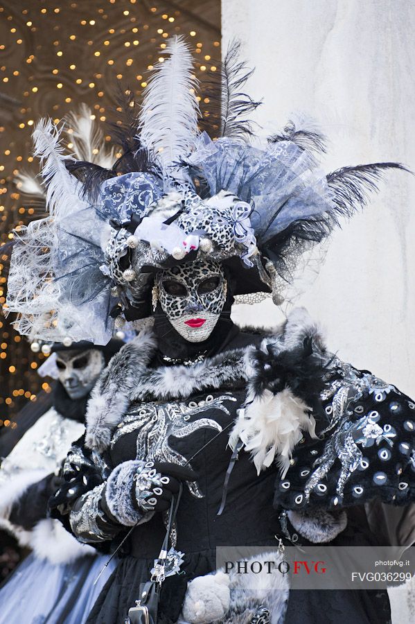 Masks of the Venice carnival in Piazza San Marco square, Venice, Italy, Europe