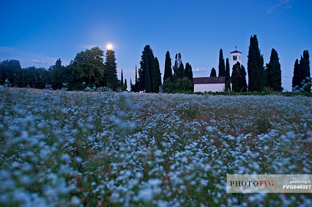 The Moon on the Santa Giuliana church, Castello d'Aviano a small village in the hills near Pordenone, Friuli Venezia Giulia, italy, Europe