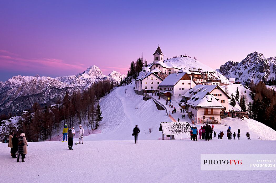 The iconic village of Monte Lussari mount in a winter sunset, Tarvisio, Julian Alps, Friuli Venezia Giulia, Italy, Europe