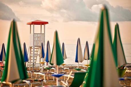 Umbrellas on the beach of the popular tourist destination of Lignano Sabbiadoro, Friuli Venezia Giulia, Italy, Europe