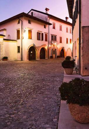 Evening view of street Cesare Battisti in the ancient village of Valvasone, Friuli Venezia Giulia, Italy, Europe