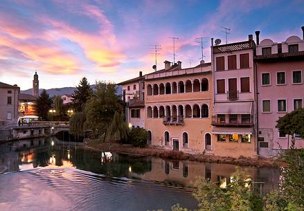 Sunset on the Livenza river that crosses the city of  Sacile. A town known as the Garden of the Serenissima, Friuli Venezia Giulia, Italy, Europe