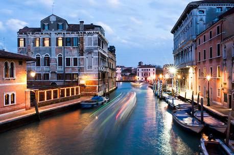 Lights and boats in the Canal of Cannareggio in Venice. On right the Palace of Labia, Venice, Italy, Europe