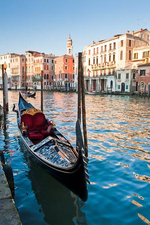 Gondola waiting on the waters of the Canal Grande in Venice, Italy, Europe