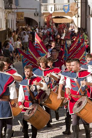 Flag-waving and drummers along the historical street of the village in a historical reconstruction of Valvasone, Friuli Venezia Giulia, Italy Flag-waving and drummers along the historical street of the village in a historical reconstruction of Valvasone, Friuli Venezia Giulia, Italy