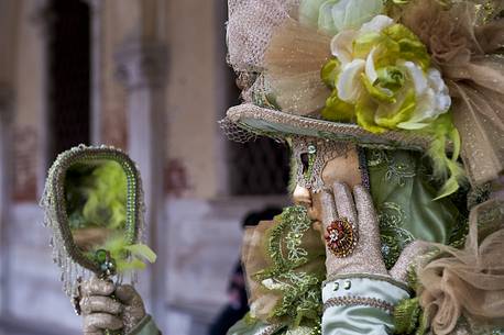 Carnival mask is mirroring in Venice, Italy