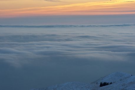 Clouds covered the Friuli lands, view from the ridge of Mount Cavallo. Friuli Venezia Giulia, Italy, Europe