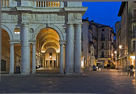 Detail of the Basilica Palladiana at twilight, It is a Renaissance building in the central Piazza dei Signori in Vicenza. Beside the statue of the architect Andrea Palladio, Vicenza, Italy, Europe