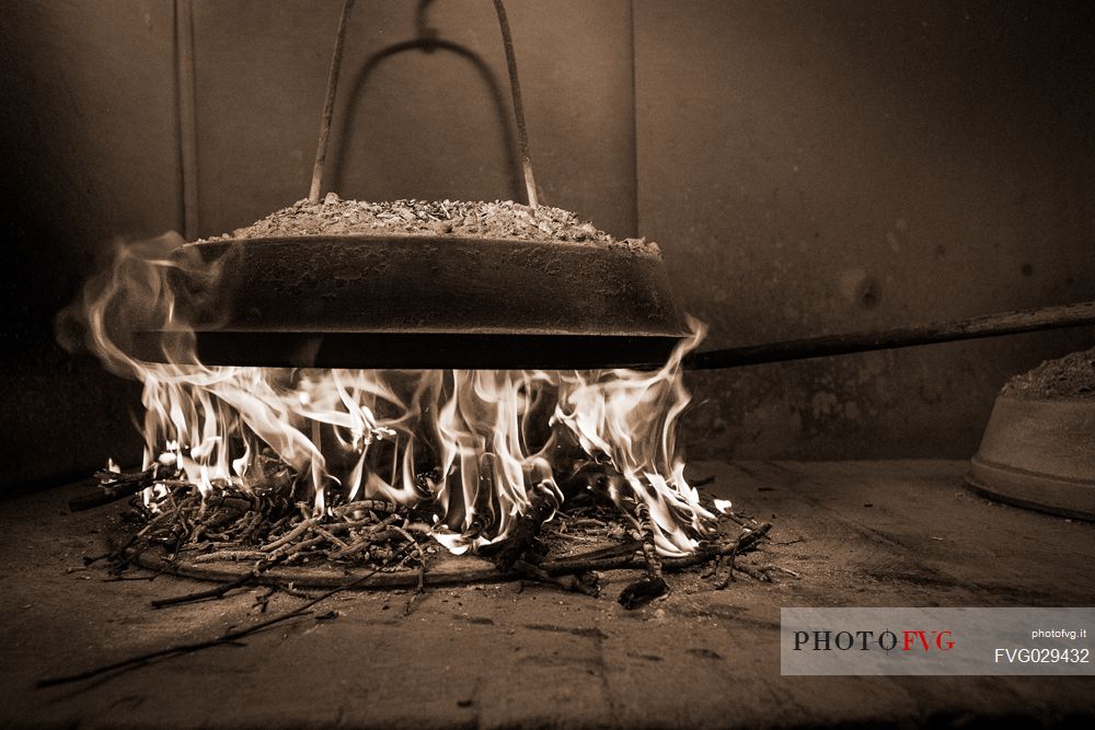 Cooking of Pattona of chestnuts , traditional food of Lunigiana, Emilia Romanga