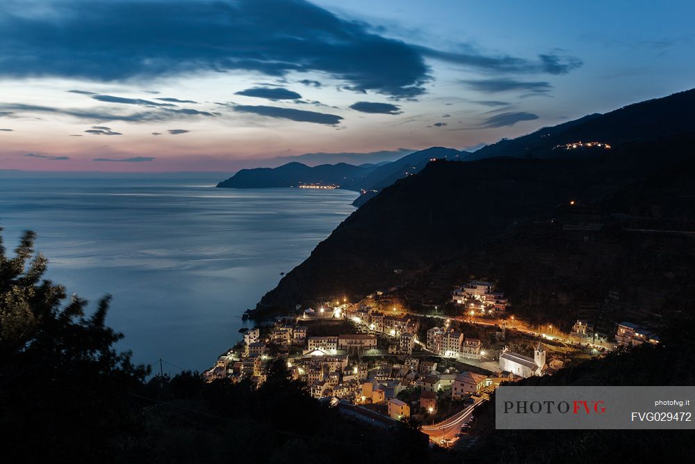 Riomaggiore illuminated at twilight, Cinque Terre, Ligury, Italy