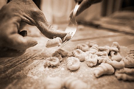 The chef preparing gnocchi, Italy