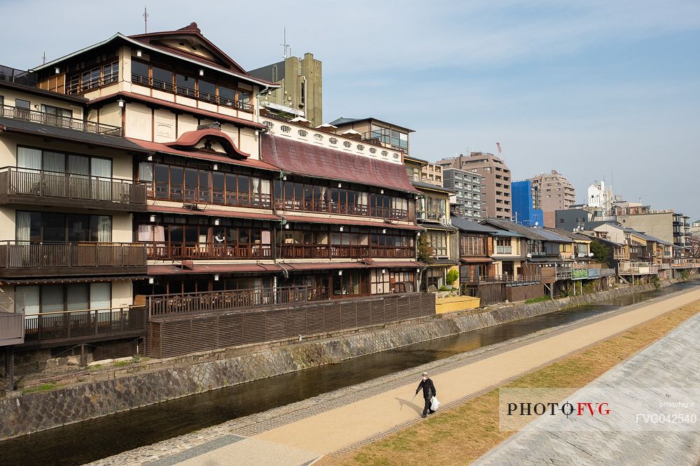 The old and the new city on the Kamo river, Kyoto, Japan