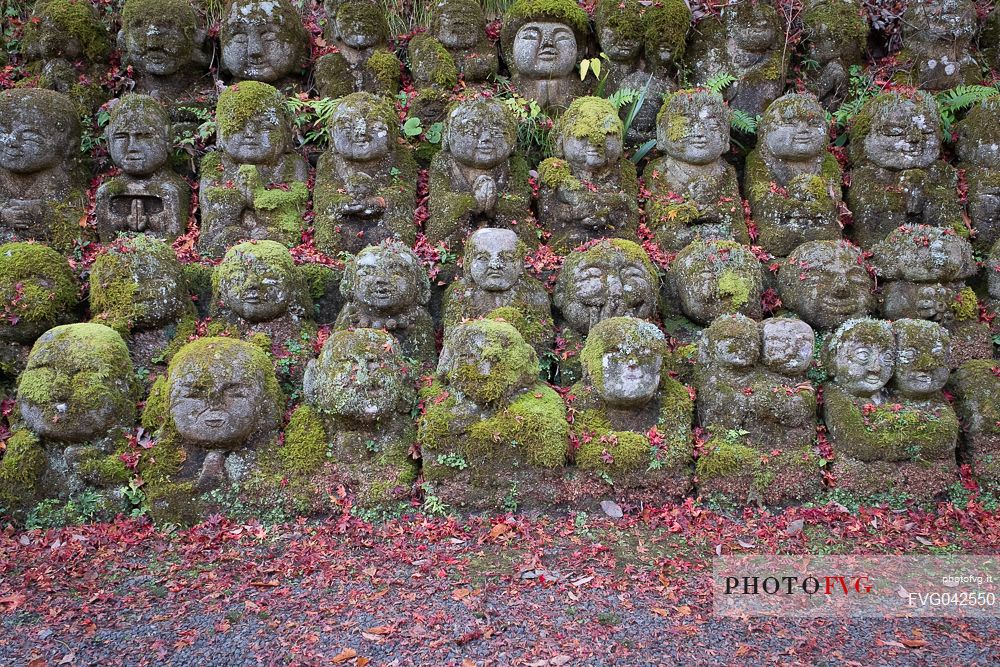 Some of the 1200 Rakan statues in Otagi Nenbutsu-ji temple in Arashiyama, Kyoto, Japan