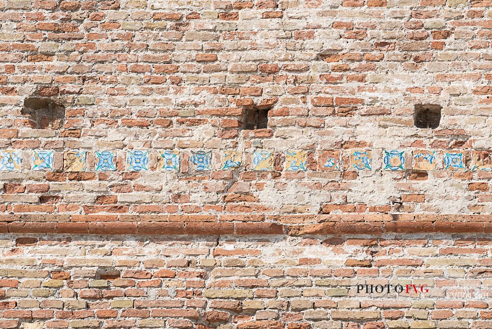 Detail of some tiles on the walls of Castel Sismondo, a castle in the center of Rimini, Emilia Romagna, Italy, 