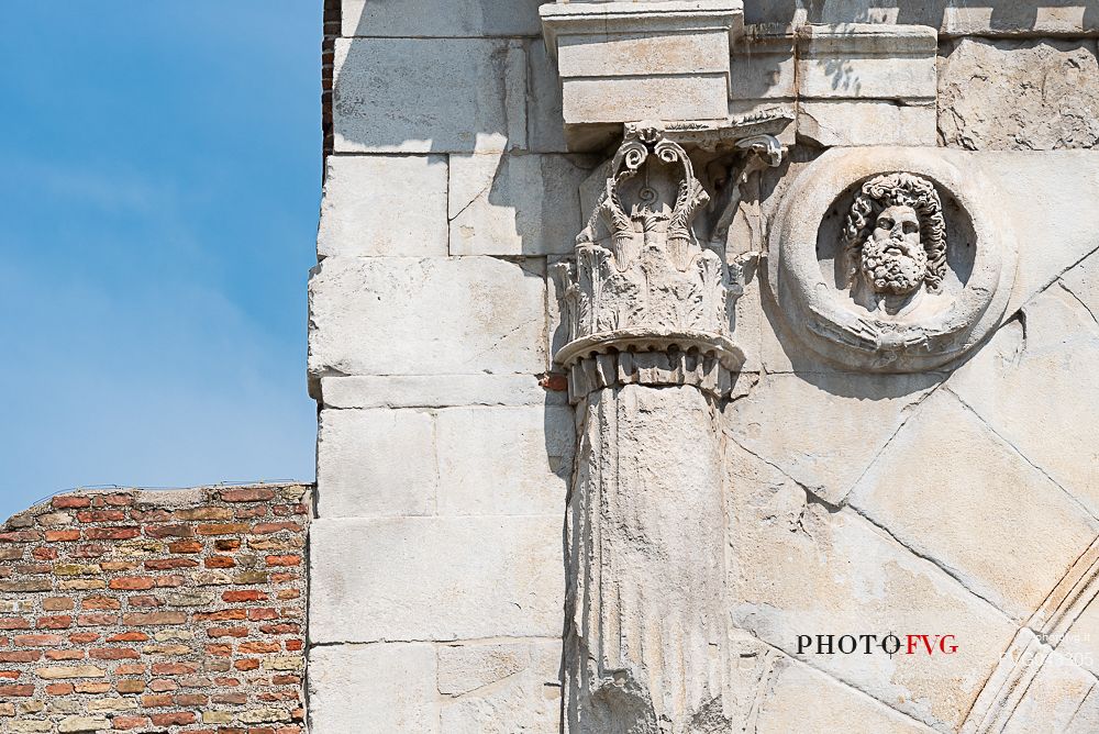 Detail with Jupiter shield and capital facing Rome.of Arch of Augustus in Rimini, Emilia Romagna, Italy, Europe