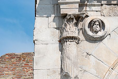 Detail with Jupiter shield and capital facing Rome.of Arch of Augustus in Rimini, Emilia Romagna, Italy, Europe Detail with Jupiter shield and capital facing Rome.of Arch of Augustus in Rimini, Emilia Romagna, Italy, Europe