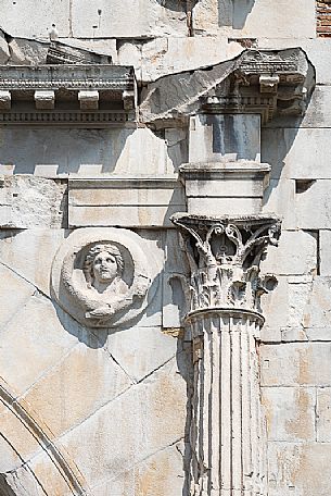 Detail with Jupiter shield and capital facing Rome.of Arch of Augustus in Rimini, Emilia Romagna, Italy, Europe Detail with Jupiter shield and capital facing Rome.of Arch of Augustus in Rimini, Emilia Romagna, Italy, Europe