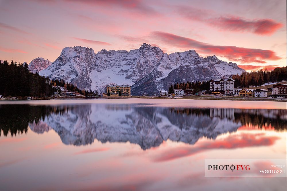 The Sorapiss reflected on the Misurina lake  during a fiery sunset