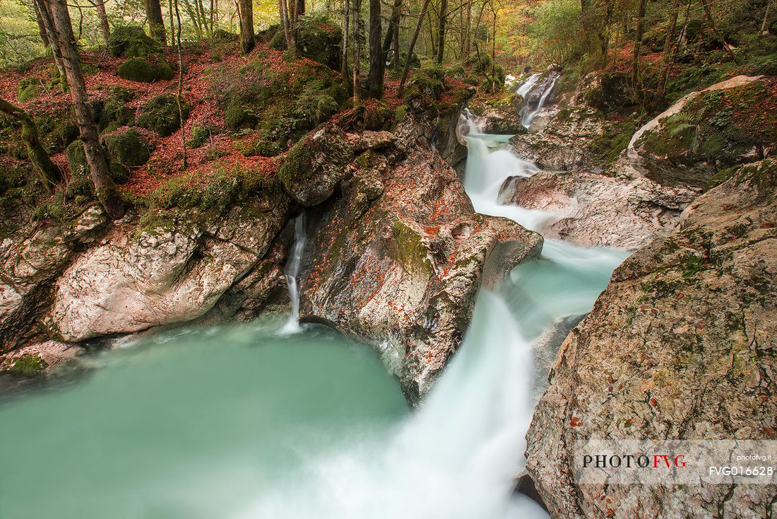 The waters of the river Lepenica form numerous waterfalls in Lepena Valley , Slovenia