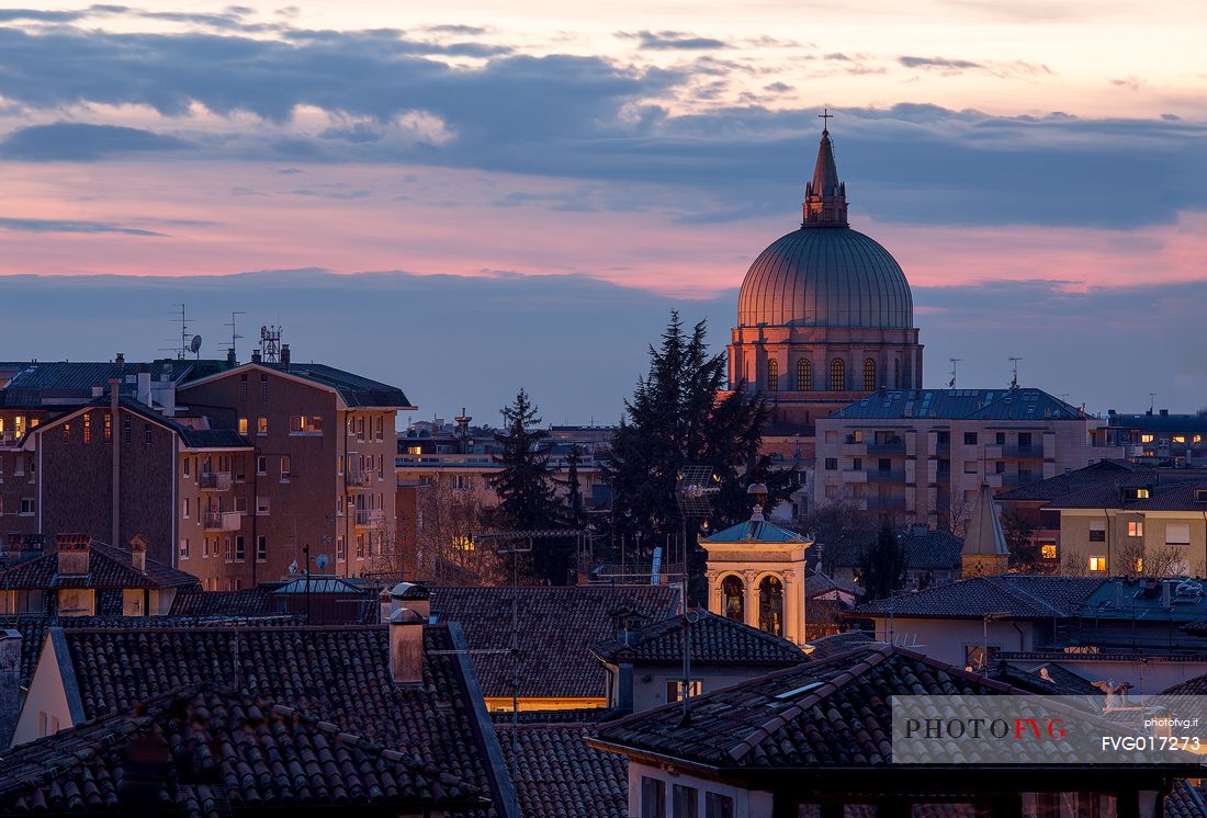 Udine view with the ''Ossario'' temple illuminated  by sunset