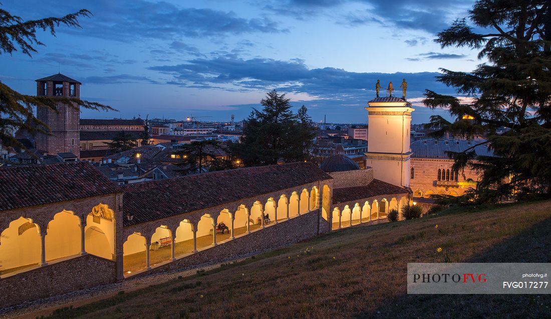 Climb to the castle of Udine and Clock Tower illuminated at blue hour