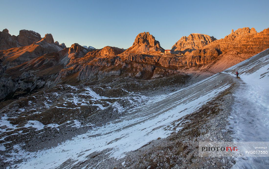 Sunset along the path that leads to the refuge Locatelli ; in the background the Sesto Dolomites Sunset along the path that leads to the refuge Locatelli ; in the background the Sesto Dolomites