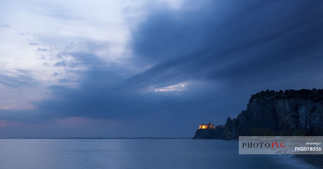 The Duino castle at blue hour photographed from Porto Piccolo's beach in Sistiana